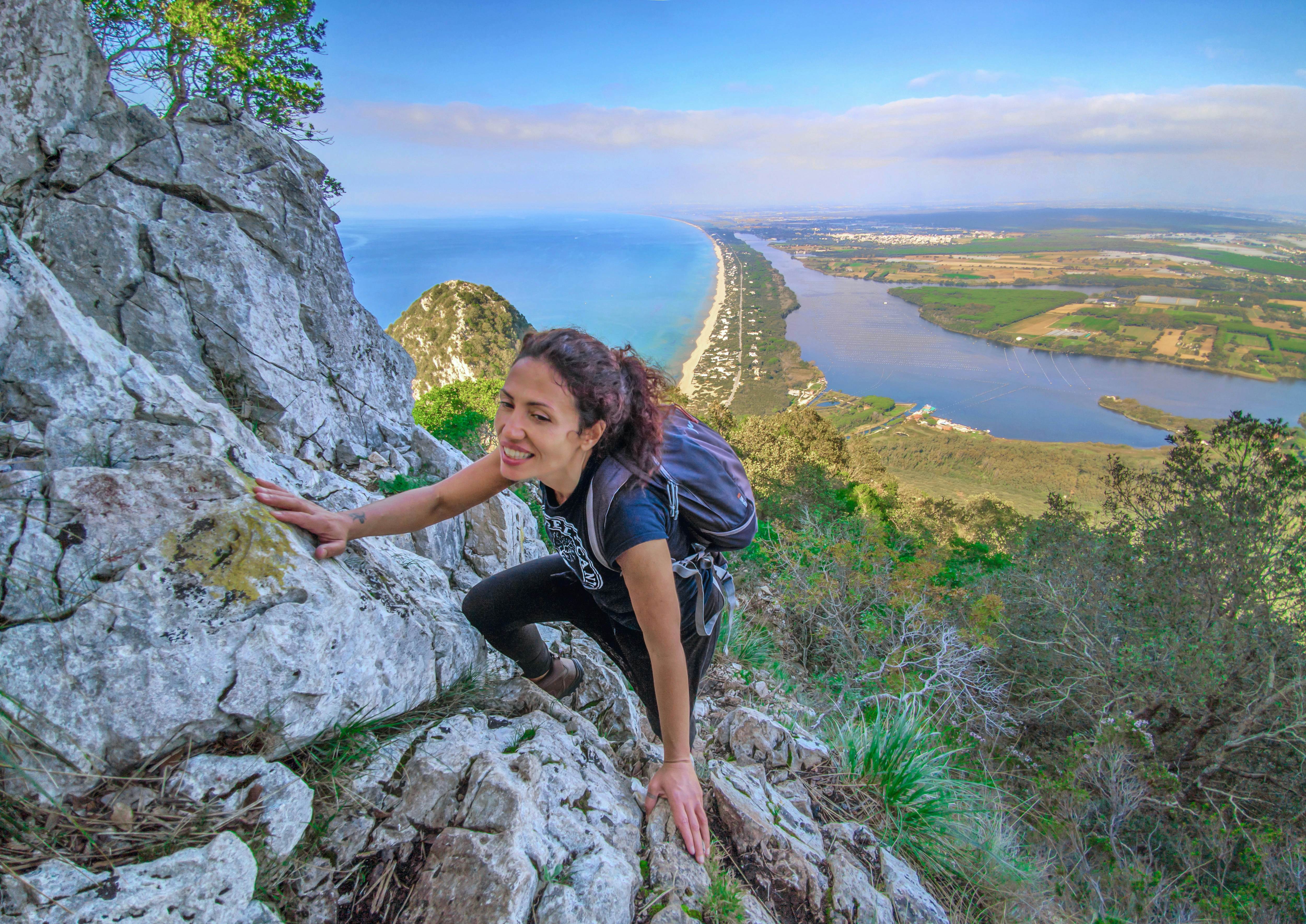 Mount Circeo, Italy - 7 November 2020 - The famous mountain on the Tirreno sea, in the province of Latina, very popular with hikers for its beautiful landscapes. Here a view from the path with girl hiker.